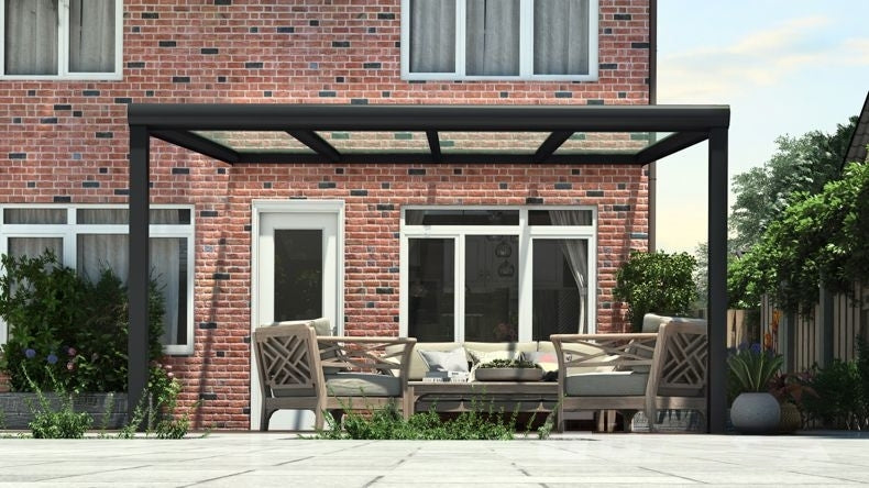 Vista Frontale di una Veranda moderna nero 9005, dimensioni 4,06 x 3,5 metri con tetto in vetro trasparente. Pergola/Gazebo elegante e resistente alle intemperie, ideale per spazi esterni raffinati e confortevoli, offre protezione UV ed è facile da montare.