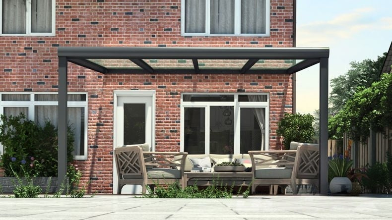 Vista Frontale di una Veranda moderna antracite 7016, dimensioni 4,06 x 3,5 metri con tetto in vetro trasparente. Pergola/Gazebo elegante e resistente alle intemperie, ideale per spazi esterni raffinati e confortevoli, offre protezione UV ed è facile da montare.