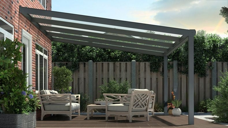 Vista laterale di una Veranda moderna antracite 7016, dimensioni 4,06 x 3,5 metri con tetto in vetro trasparente. Pergola/Gazebo elegante e resistente alle intemperie, ideale per spazi esterni raffinati e confortevoli, offre protezione UV ed è facile da montare.