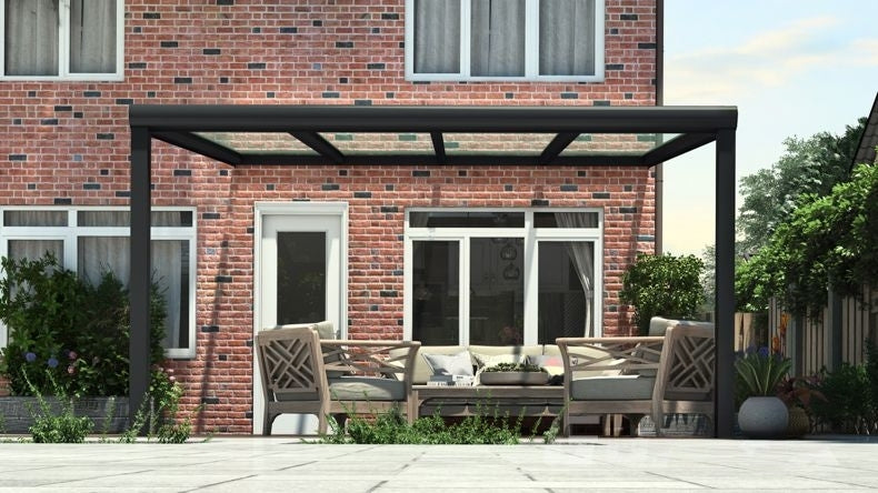 Vista Frontale di una Veranda moderna nero 9005, dimensioni 4,06 x 4,0 metri con tetto in vetro trasparente. Pergola/Gazebo elegante e resistente alle intemperie, ideale per spazi esterni raffinati e confortevoli, offre protezione UV ed è facile da montare.